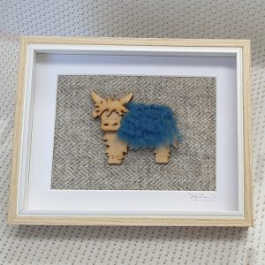 HIGHLAND COO AND HARRIS TWEED PICTURE