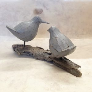 CARVED WOODEN BIRDS ON DRIFTWOOD DETAIL