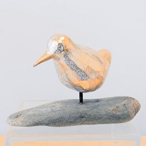 CARVED WOODEN BIRD ON DRIFTWOOD